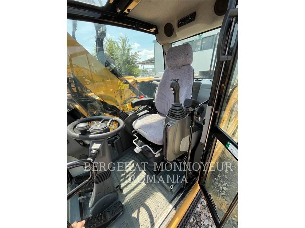CAT M318F Pelle sur pneus