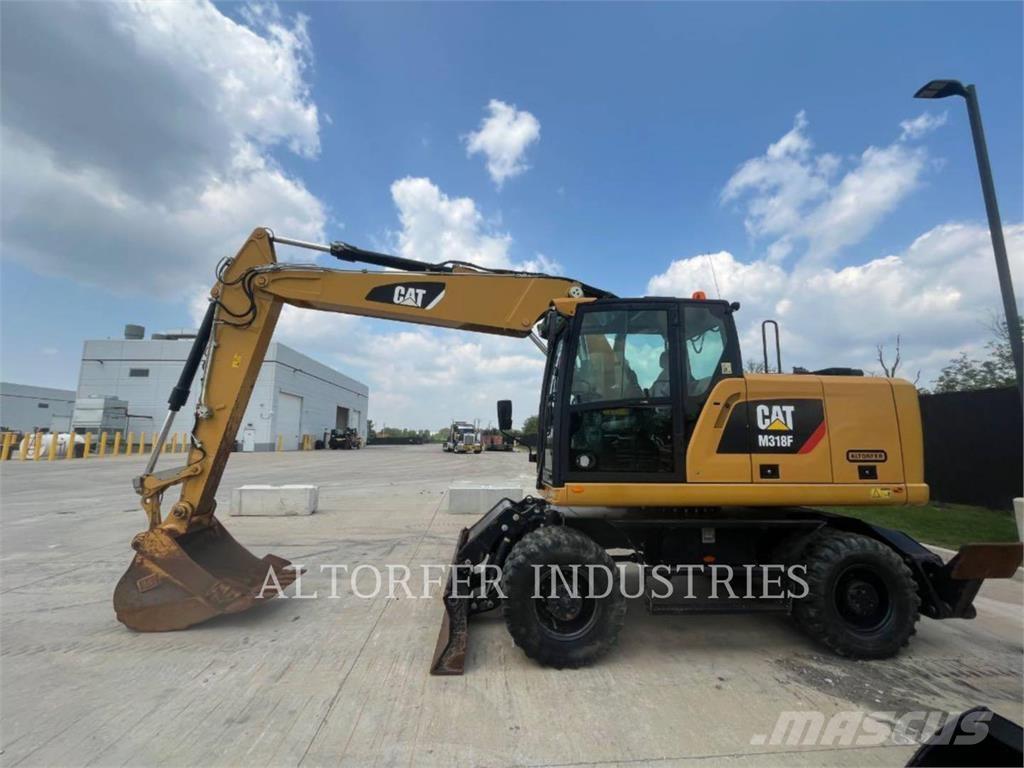 CAT M318F Pelle sur chenilles