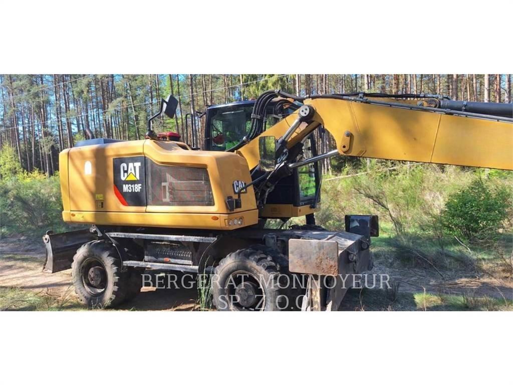 CAT M318F Pelle sur pneus