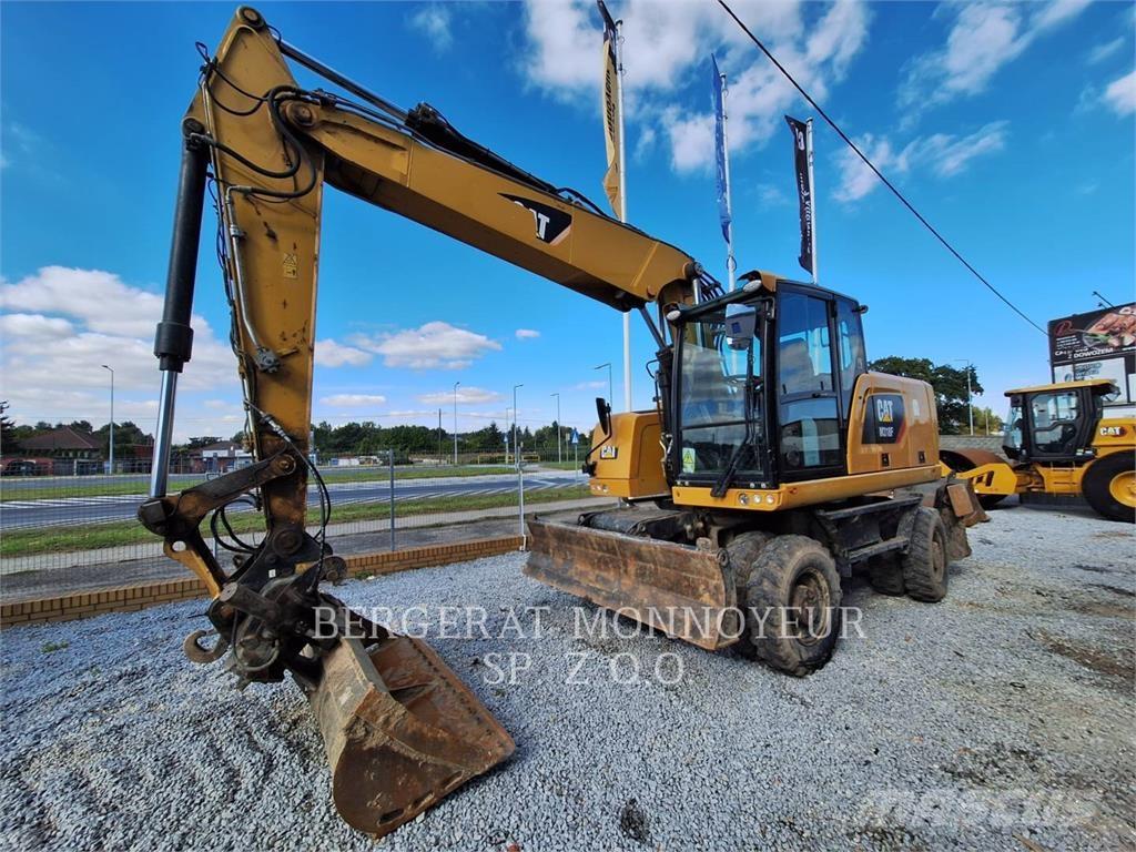 CAT M318F Pelle sur pneus