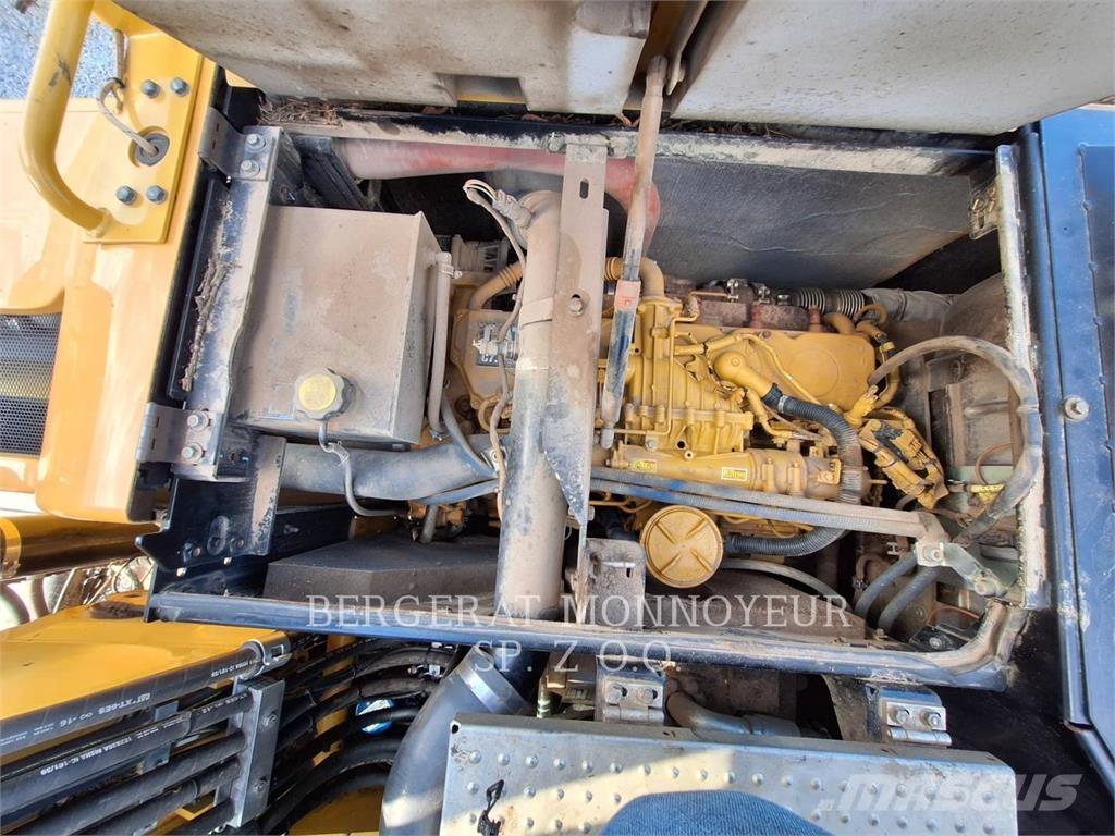 CAT M318F Pelle sur pneus