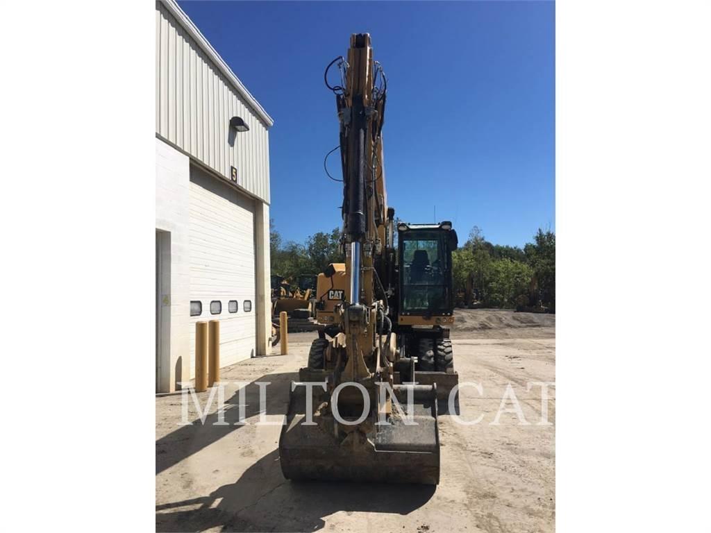 CAT M318F Pelle sur pneus