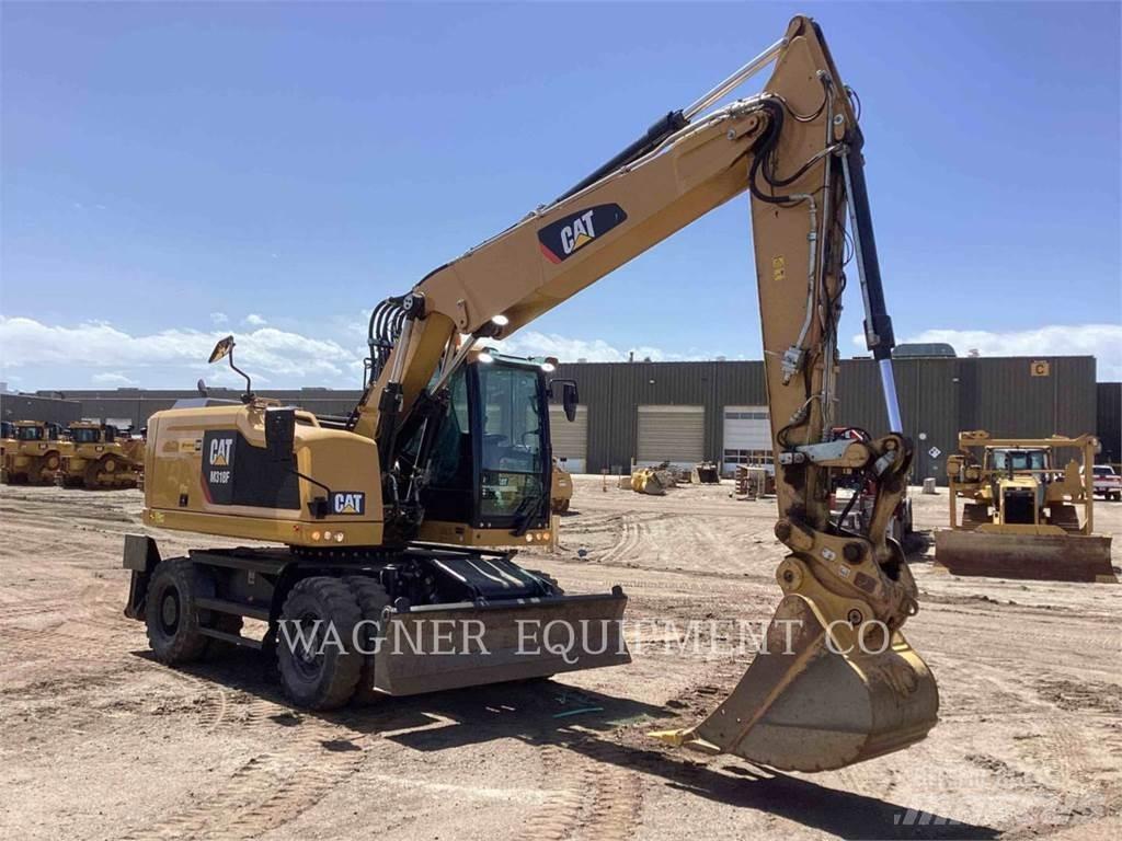 CAT M318F Pelle sur pneus