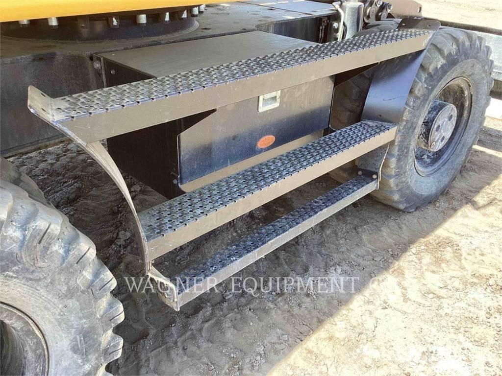 CAT M318F Pelle sur pneus