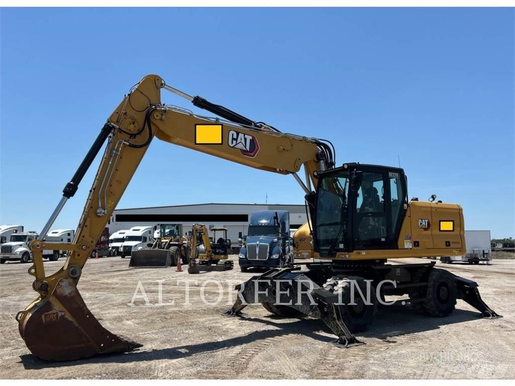 CAT M320 Pelle sur pneus