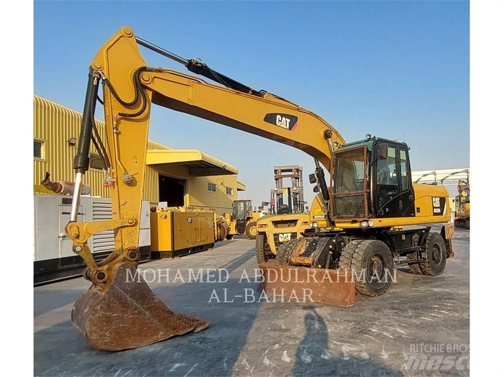 CAT M320D2 Pelle sur pneus