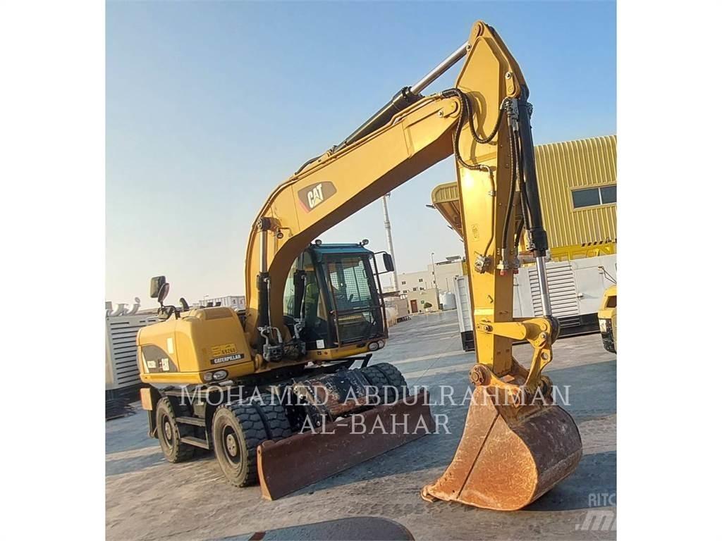 CAT M320D2 Pelle sur pneus