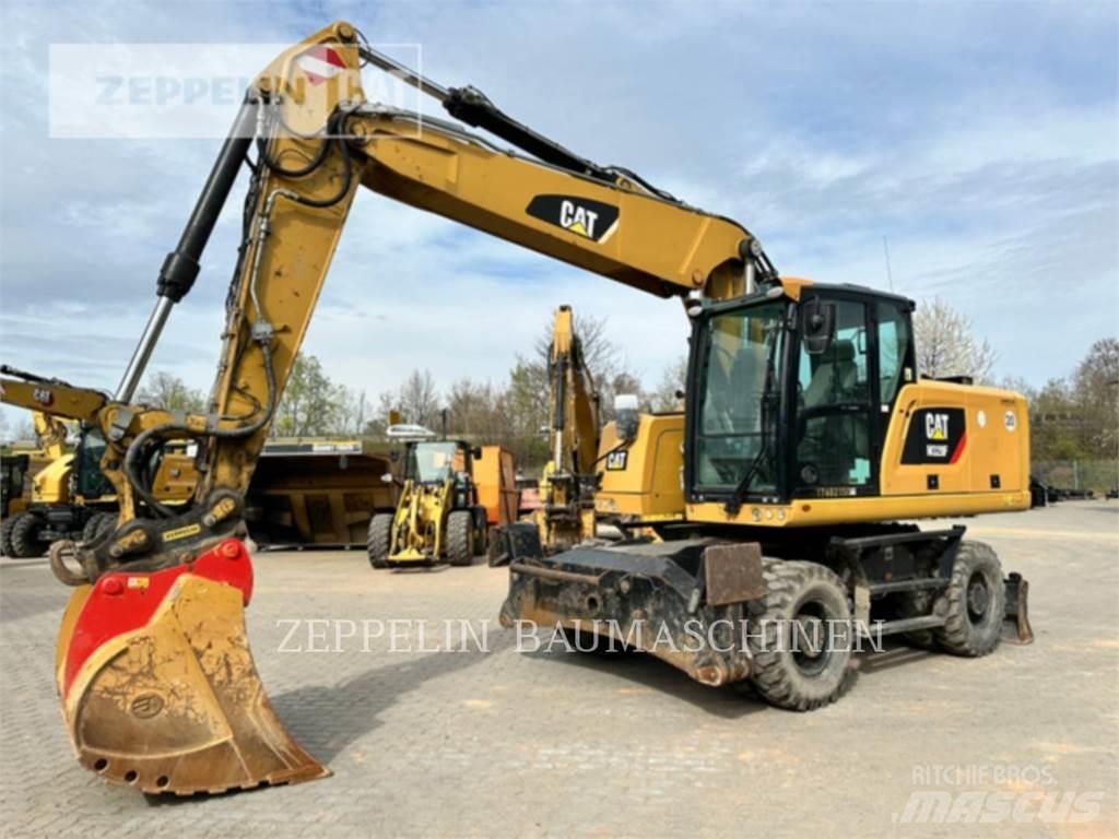 CAT M320F Pelle sur pneus