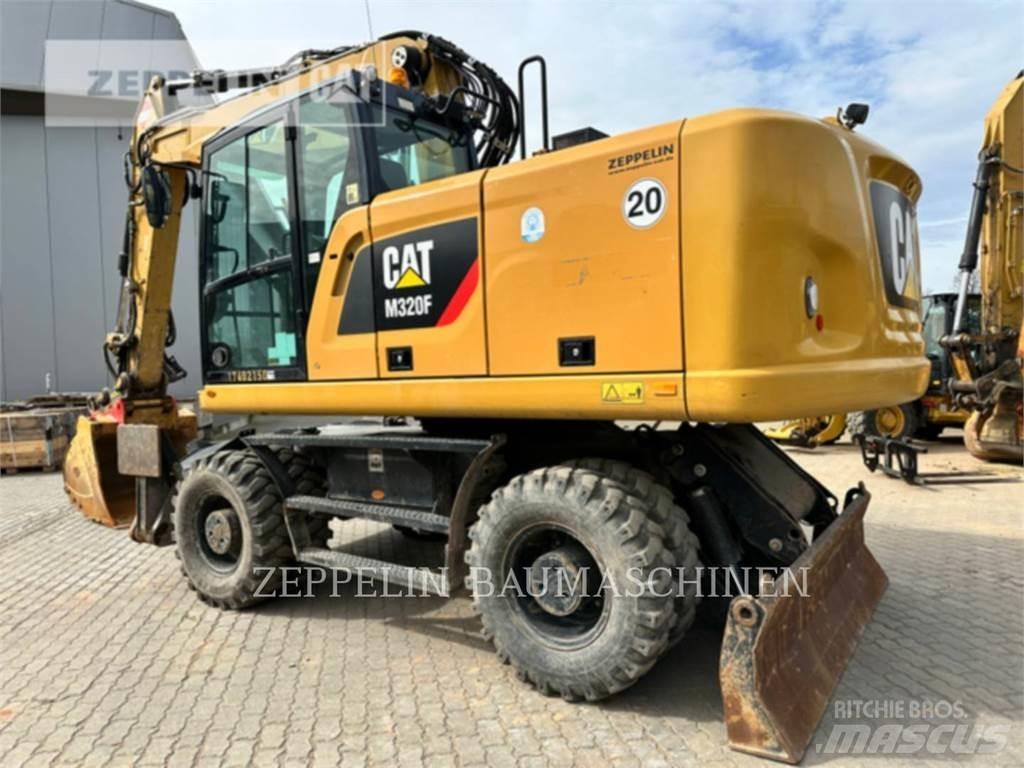 CAT M320F Pelle sur pneus