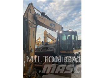 CAT M320F Pelle sur pneus