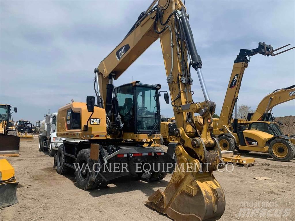CAT M320F Pelle sur pneus