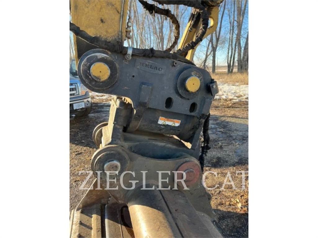 CAT M320F Pelle sur pneus