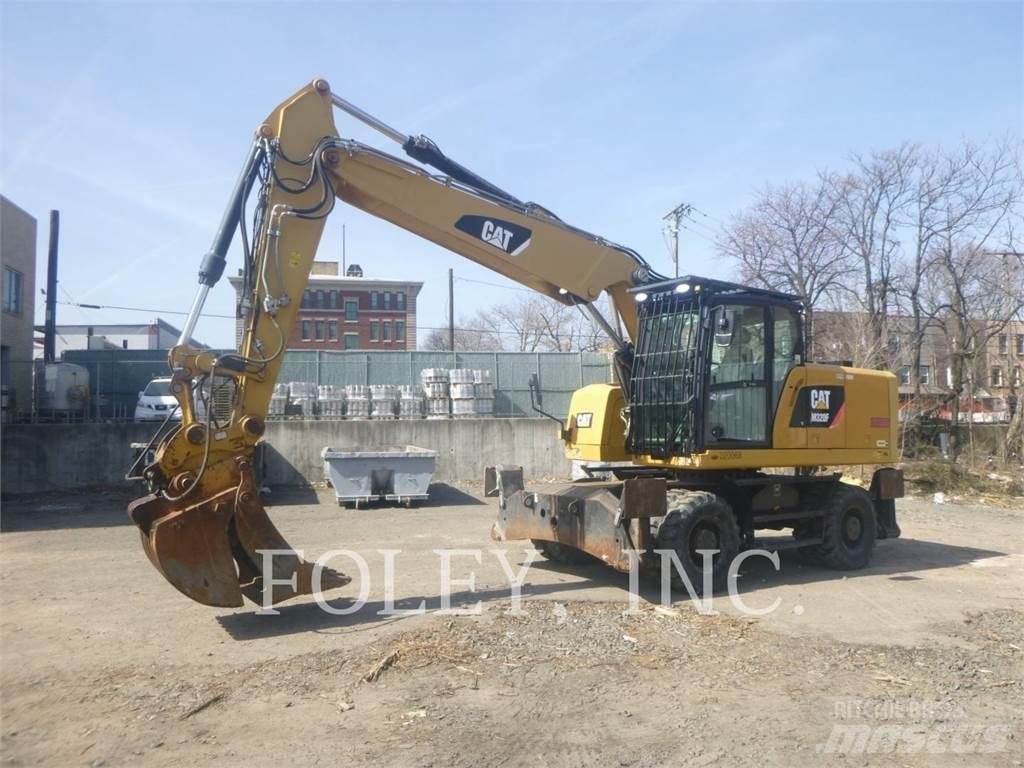 CAT M320F Pelle sur pneus