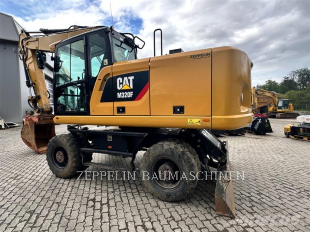 CAT M320F Pelle sur pneus