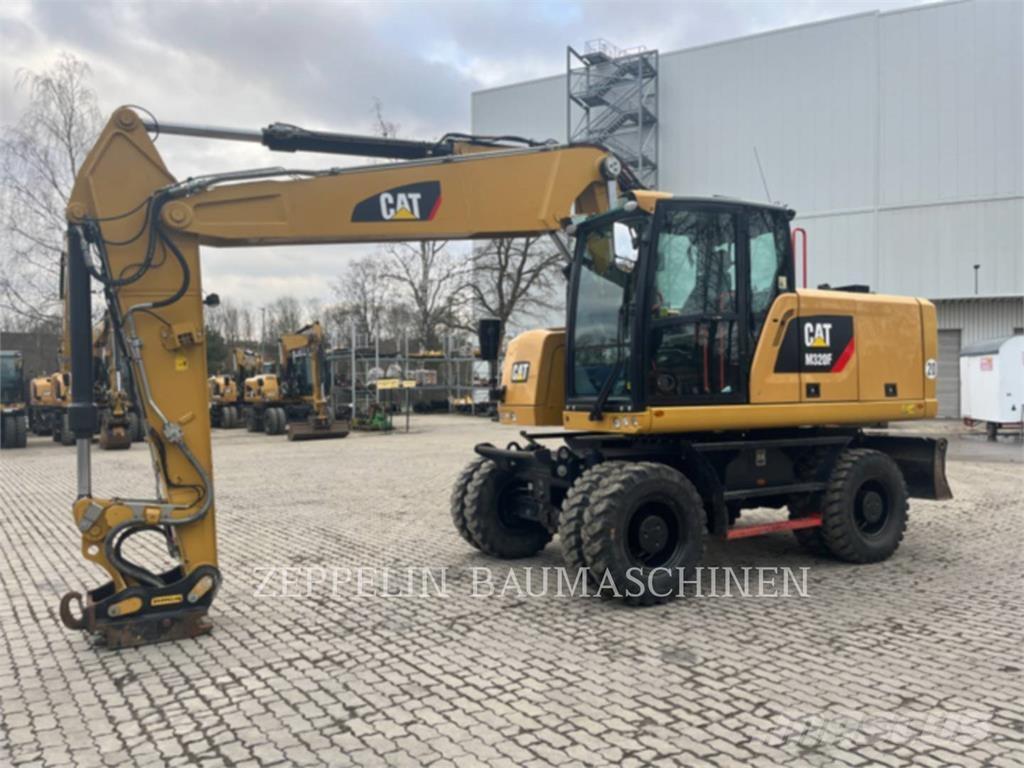 CAT M320F Pelle sur pneus
