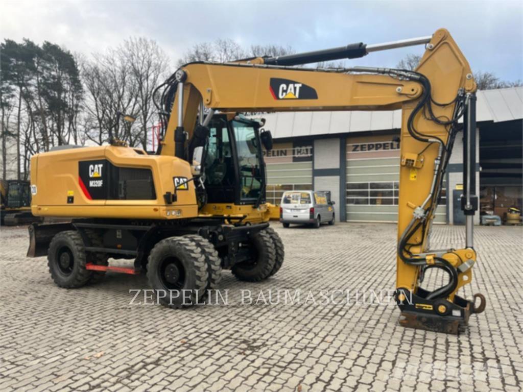 CAT M320F Pelle sur pneus