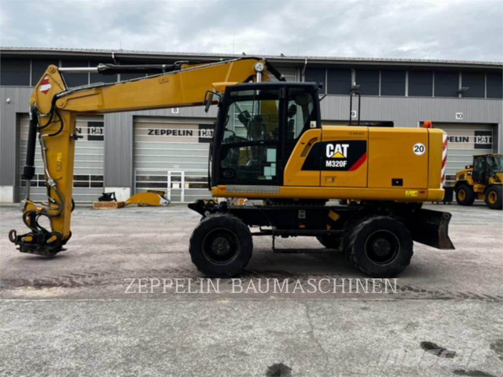 CAT M320F Pelle sur pneus