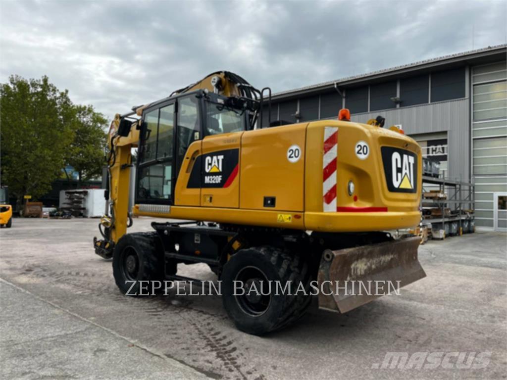 CAT M320F Pelle sur pneus