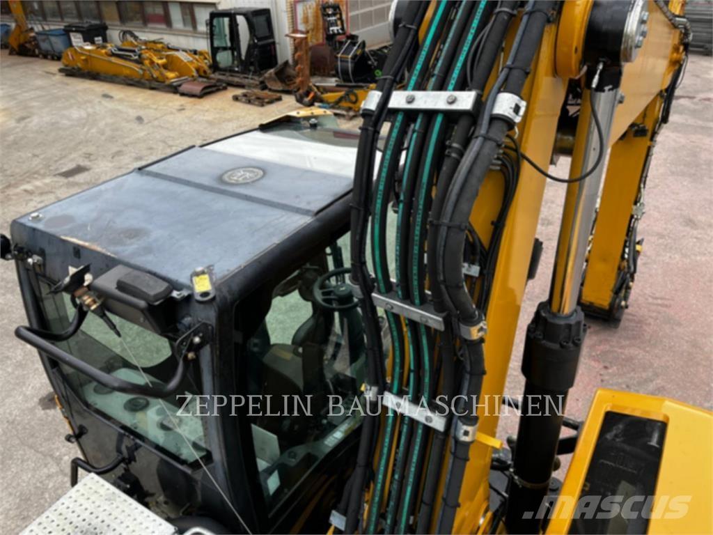 CAT M320F Pelle sur pneus