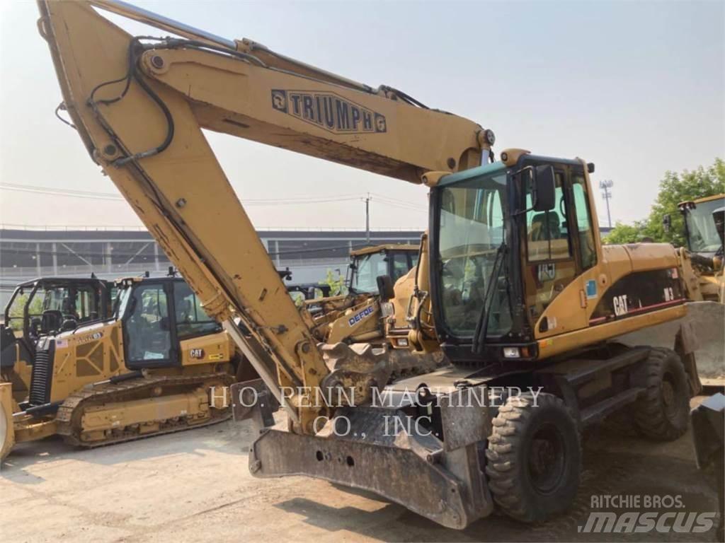 CAT M322C Pelle sur pneus