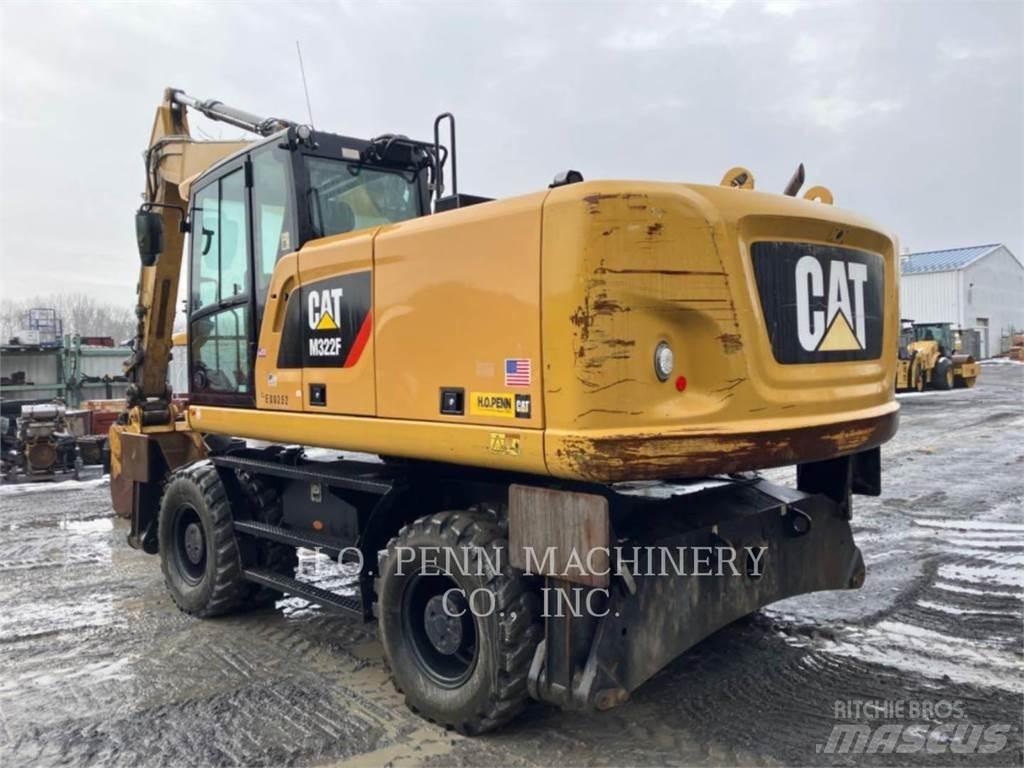 CAT M322F Pelle sur pneus