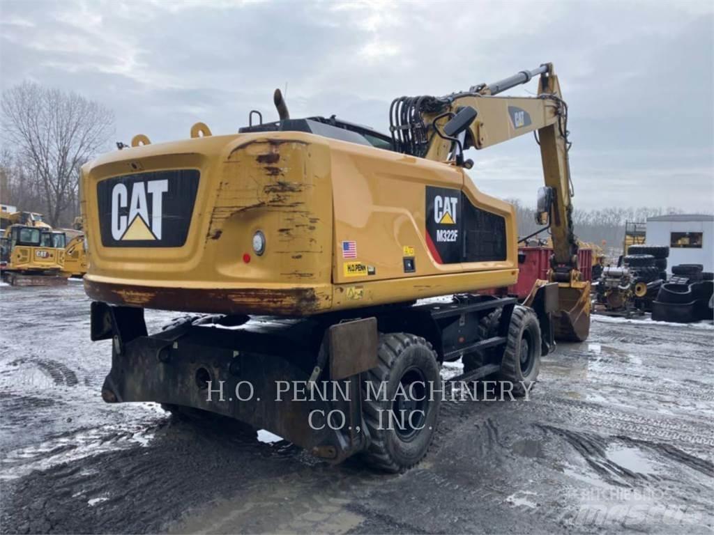 CAT M322F Pelle sur pneus