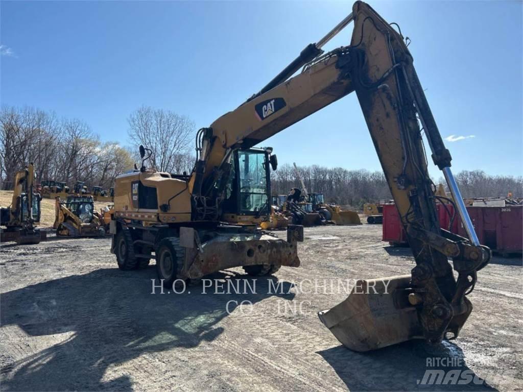CAT M322F Pelle sur pneus