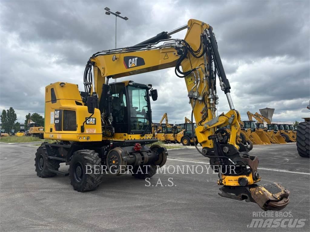 CAT M323F Pelle sur pneus