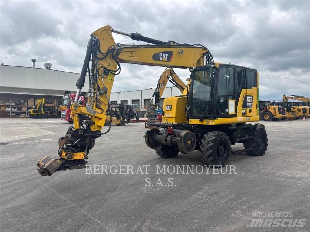 CAT M323F Pelle sur pneus