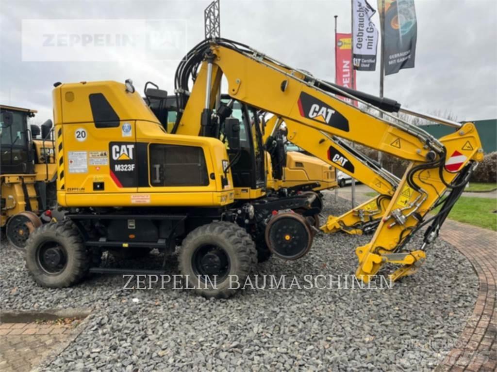 CAT M323F Pelle sur pneus