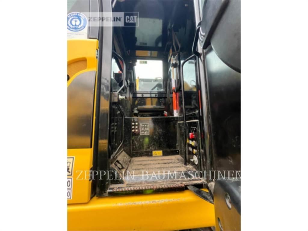 CAT M323F Pelle sur pneus