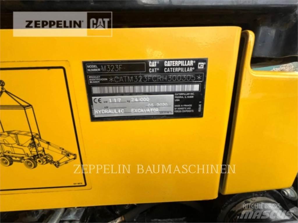 CAT M323F Pelle sur pneus