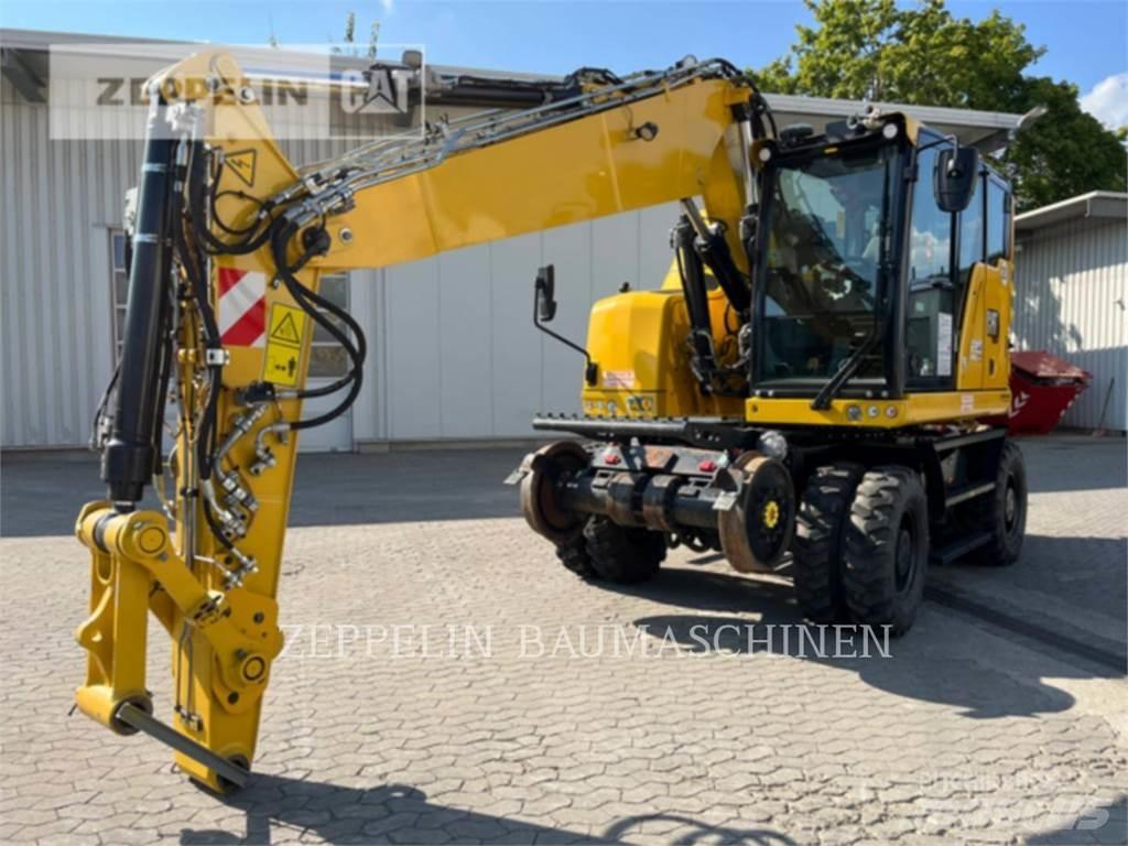 CAT M323F Pelle sur pneus