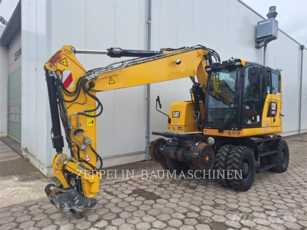 CAT M323F Pelle sur pneus