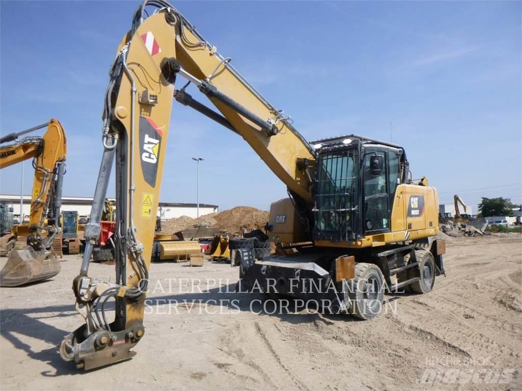 CAT MH3022-06 Pelle sur pneus