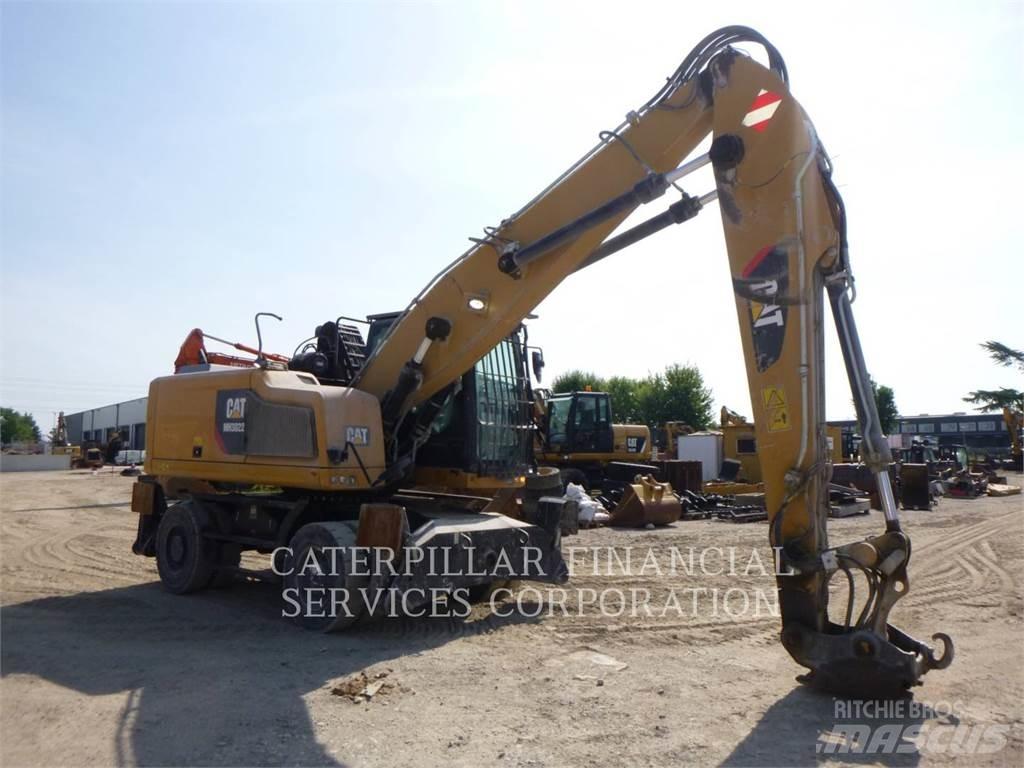 CAT MH3022-06 Pelle sur pneus