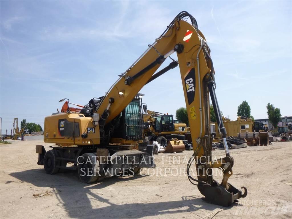 CAT MH3022-06 Pelle sur pneus