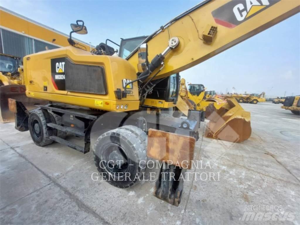 CAT MH3024 Pelle sur pneus