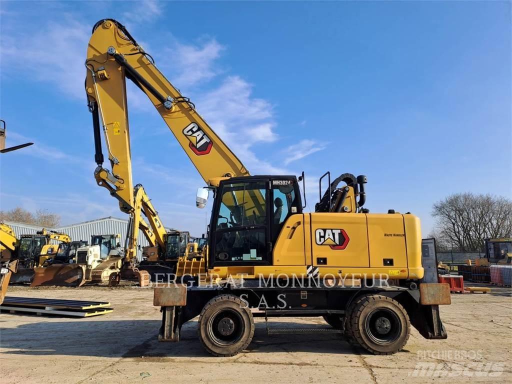 CAT MH3024 Pelle sur pneus