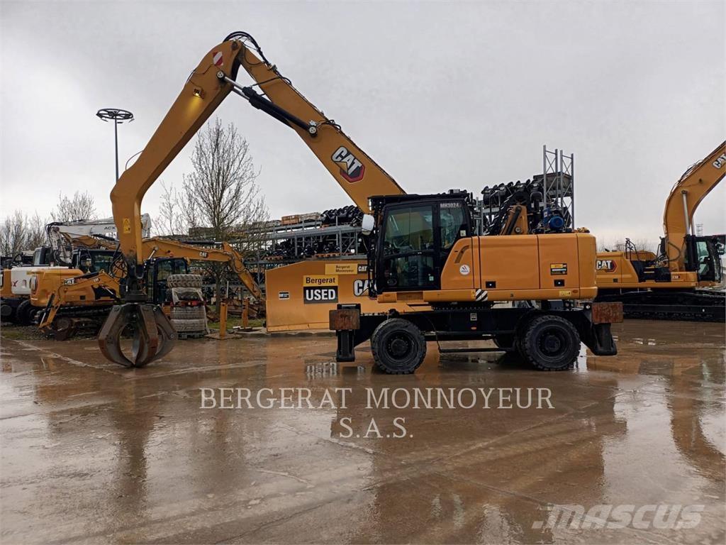 CAT MH3024-1 Pelle sur pneus