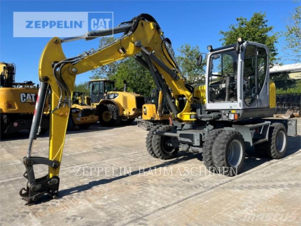 Neuson EW100 Pelle sur pneus