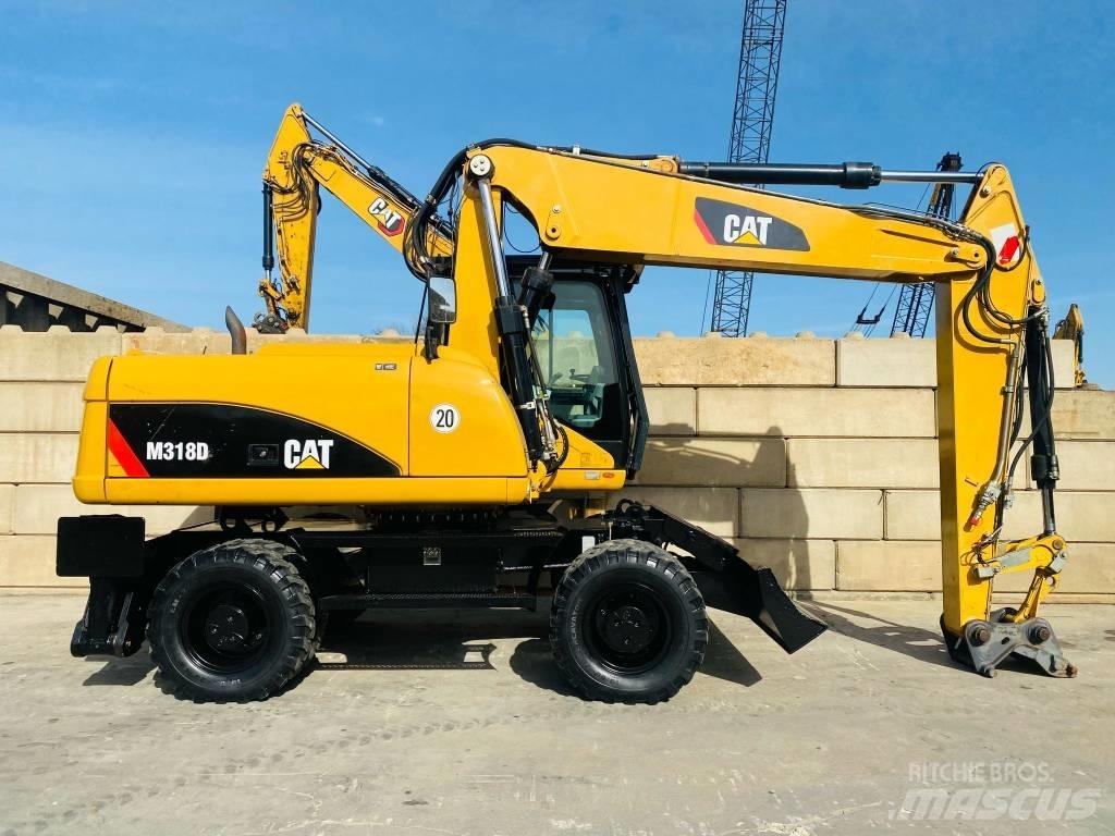 CAT M 318 D Pelle sur pneus