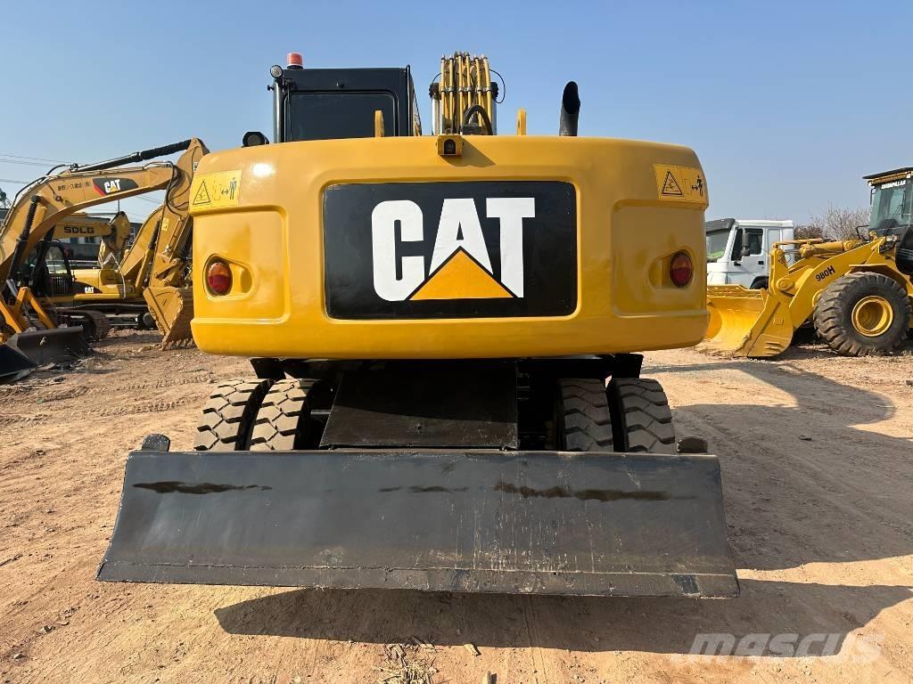 CAT M 320D Pelle sur pneus