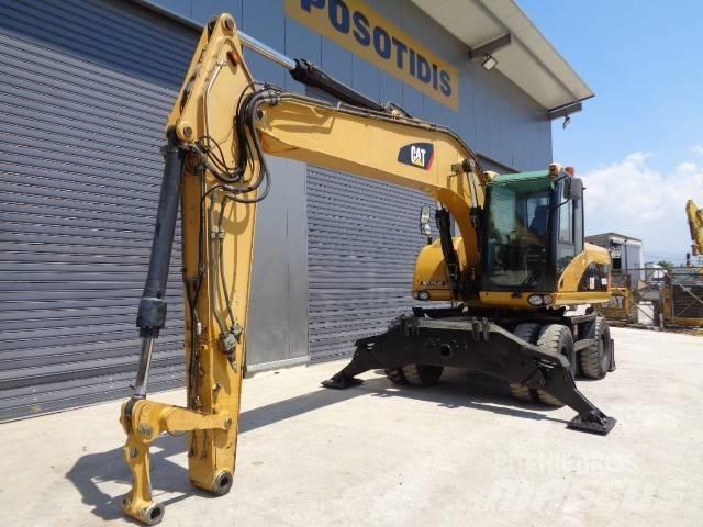 CAT M 318 D Pelle sur pneus