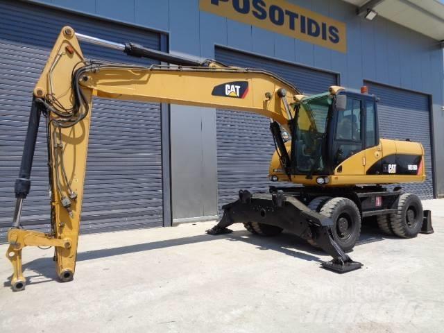 CAT M 318 D Pelle sur pneus