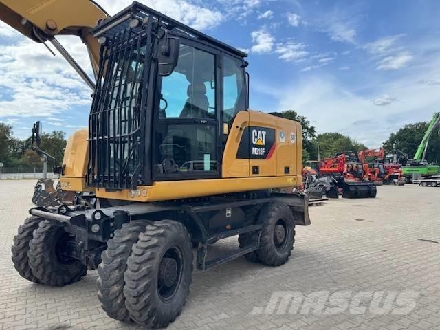 CAT M 318 F Pelle sur pneus