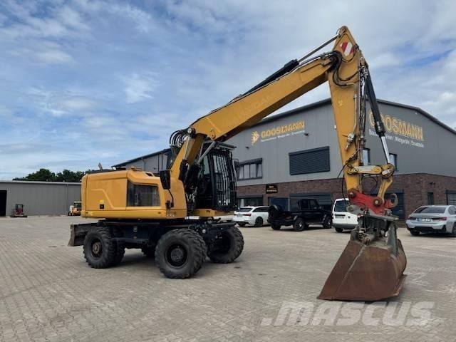CAT M 318 F Pelle sur pneus