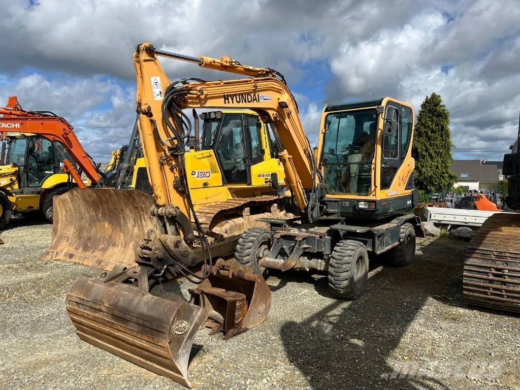 Hyundai R55W-9 Pelle sur pneus