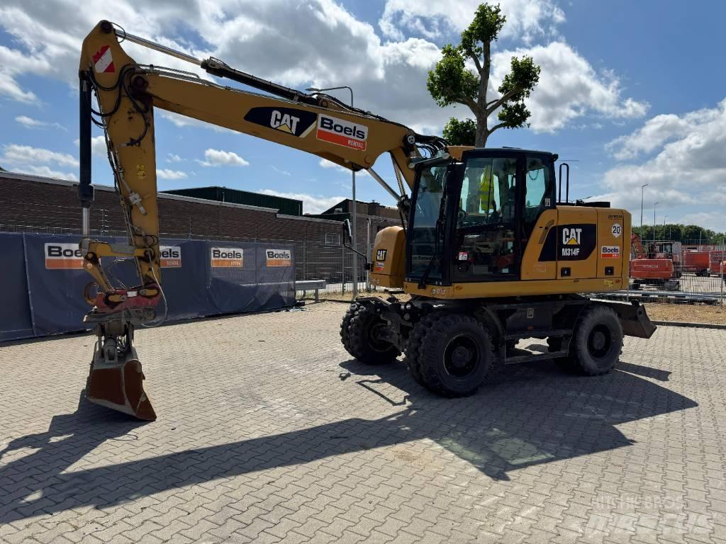CAT M314F Pelle sur pneus