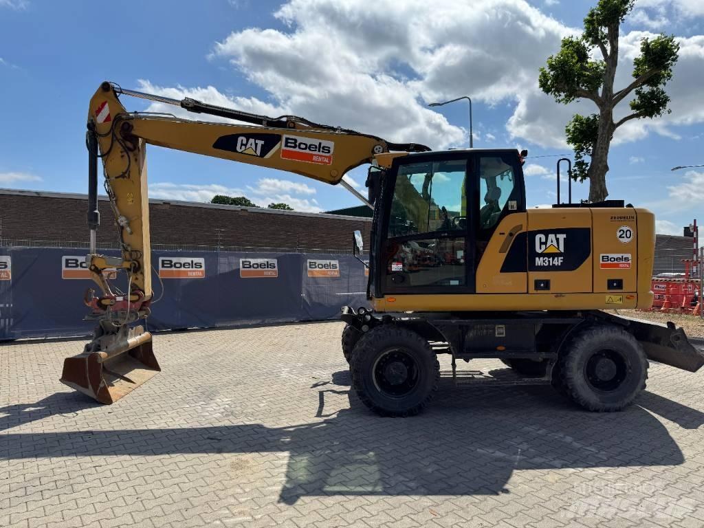 CAT M314F Pelle sur pneus
